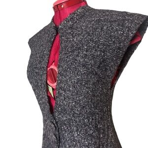 Orb knit sleeveless sweater vest with waist and neck closure cable knit sections